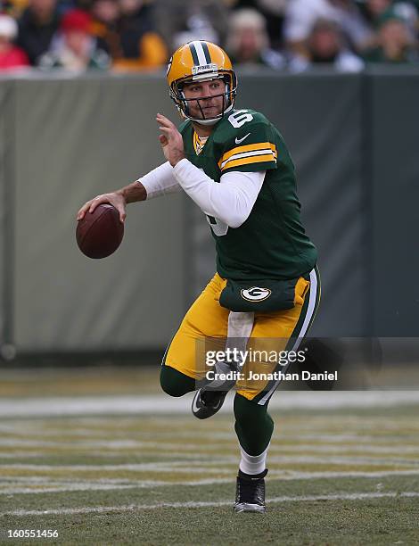 Graham Harrell of the Green Bay Packers rolls out to pass against the Tennessee Titans at Lambeau Field on December 23, 2012 in Green Bay, Wisconsin....