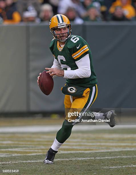 Graham Harrell of the Green Bay Packers rolls out to pass against the Tennessee Titans at Lambeau Field on December 23, 2012 in Green Bay, Wisconsin....