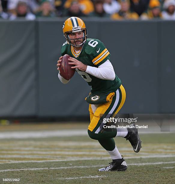 Graham Harrell of the Green Bay Packers rolls out to pass against the Tennessee Titans at Lambeau Field on December 23, 2012 in Green Bay, Wisconsin....