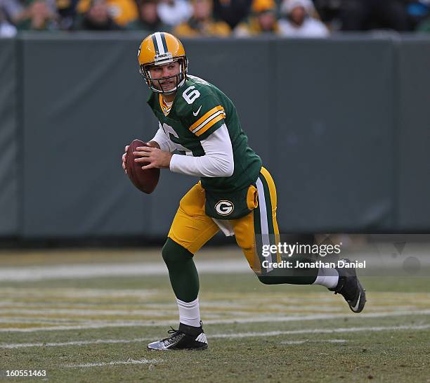 Graham Harrell of the Green Bay Packers rolls out to pass against the Tennessee Titans at Lambeau Field on December 23, 2012 in Green Bay, Wisconsin....