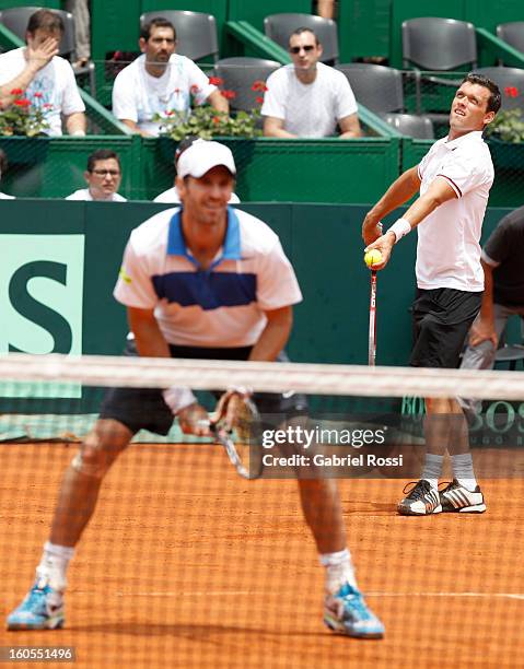 Christopher Kas and Tobias Kamke of Germany in action during the match against David Nalbandian and Horacio Zeballos of Argentina on the second day...