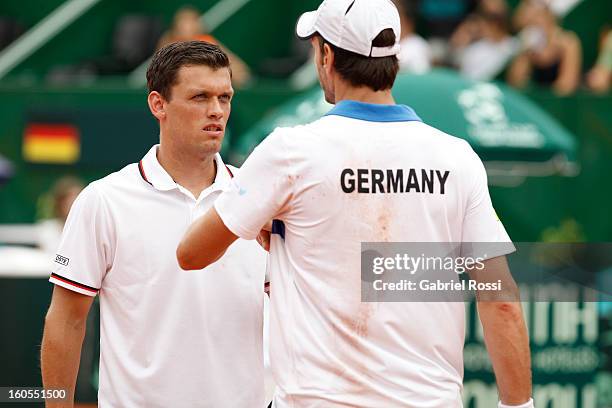 Christopher Kas and Tobias Kamke of Germany talk during the match against David Nalbandian and Horacio Zeballos of Argentina on the second day of...