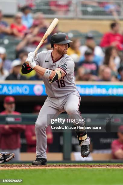 Carson Kelly of the Arizona Diamondbacks bats against the Minnesota Twins on August 6, 2023 at Target Field in Minneapolis, Minnesota.