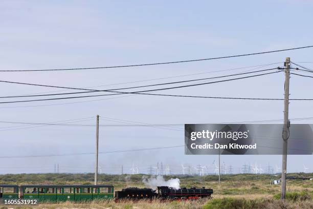 The Romney, Hythe and Dymchurch Railway train makes its way across Dungeness on August 10, 2023 in Camber, United Kingdom.