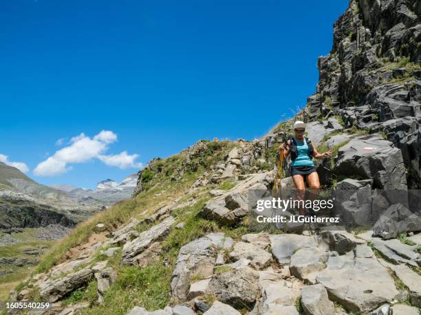 woman doing sport and hiking in ordesa national park, in the pyrenees, huesca, spain - ordesa national park stock pictures, royalty-free photos & images