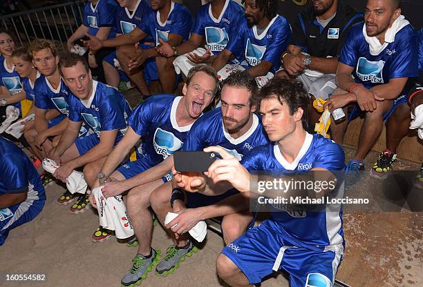 The blue team celebrates their win during the DIRECTV'S Seventh Annual Celebrity Beach Bowl at DTV SuperFan Stadium at Mardi Gras World on February...