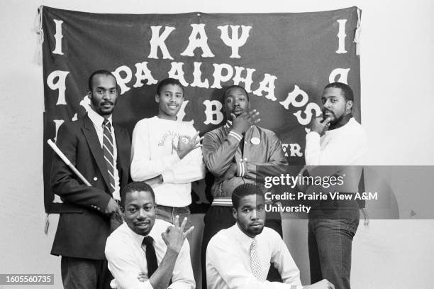 University students posing for photograph during event.