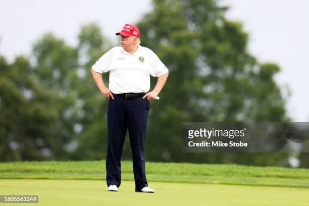 Former President Donald Trump looks on during the pro-am prior to the LIV Golf Invitational - Bedminster at Trump National Golf Club on August 10,...