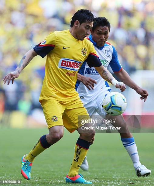 Argentine Rubens Sambueza of America fights for the ball with Dionicio Escalante of Queretaro during a Clausura 2013 Liga MX match at Azteca Stadium...