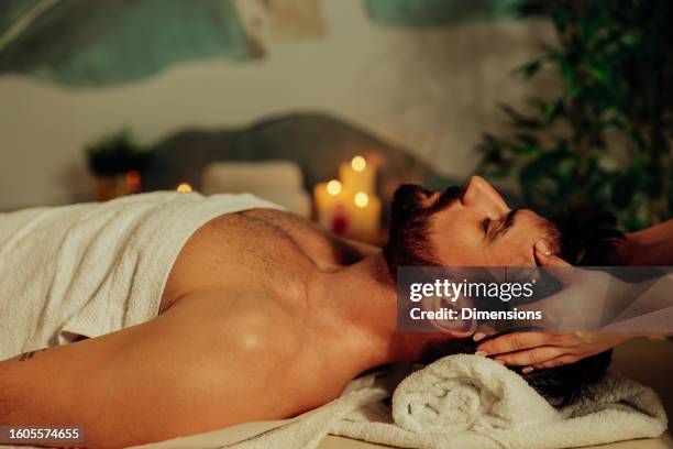 man enjoying massage at spa - man massage stock pictures, royalty-free photos & images