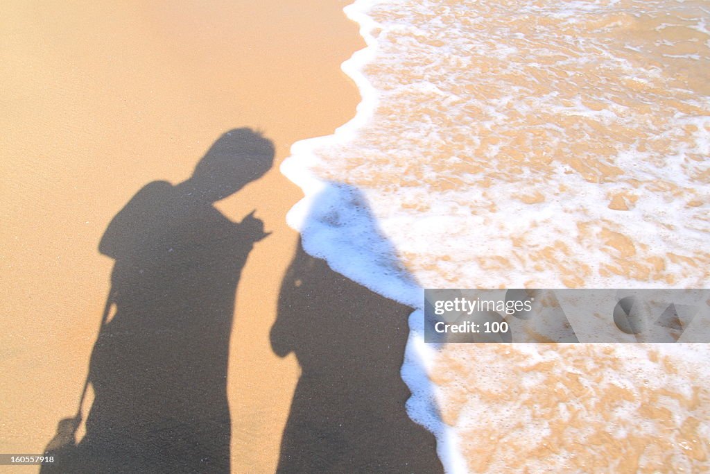 Lovers' shadow on the beach