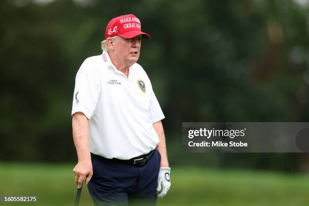 Former President Donald Trump looks on during the pro-am prior to the LIV Golf Invitational - Bedminster at Trump National Golf Club on August 10,...