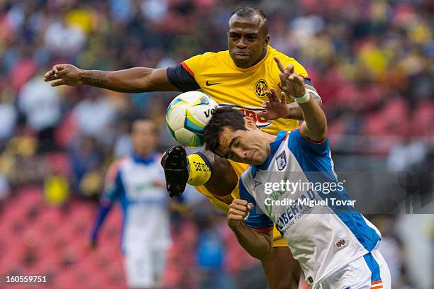 February 02: Christian Benitez of America fights for the ball with Mario Osuna of Queretaro during a Clausura 2013 Liga MX match at Azteca Stadium on...