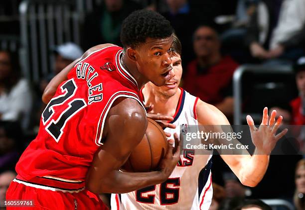 Jimmy Butler of the Chicago Bulls steals the ball from Kyle Korver of the Atlanta Hawks at Philips Arena on February 2, 2013 in Atlanta, Georgia....