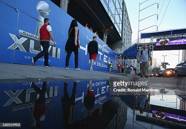 Fans walk down the streets prior to Super Bowl XLVII on February 2, 2013 in New Orleans, Louisiana.