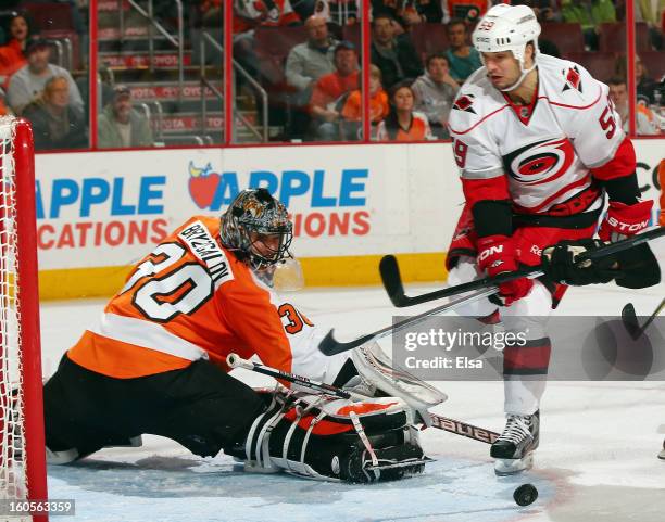 Ilya Bryzgalov of the Philadelphia Flyers stops a shot by Chad LaRose of the Carolina Hurricanes on February 2, 2013 at the Wells Fargo Center in...