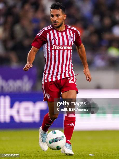 Joao Carvalho of Olympiakos Piraeus runs with the ball during the UEFA Europe League Qualification Third Round Second Leg match between KRC Genk and...