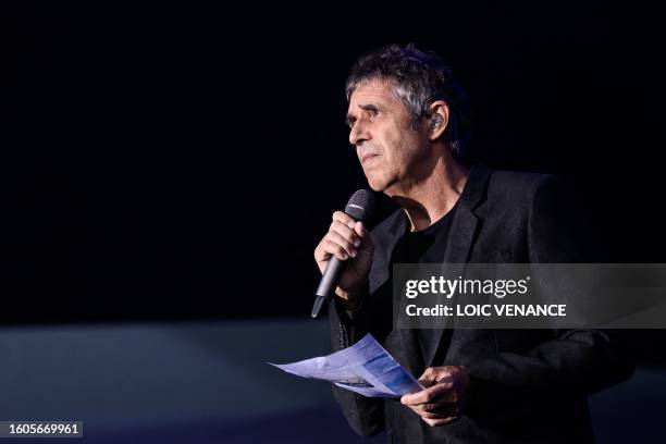 French singer Julien Clerc addresses the audience as he pays tribute to his half-brother Gerard Leclerc in La Baule, western France, on August 17...