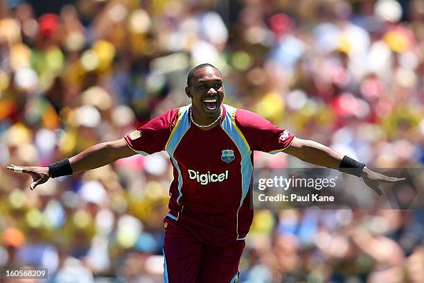 Dwayne Bravo of the West Indies celebrates the wicket of Michael Clarke of Australia during game two of the Commonwealth Bank One Day International...