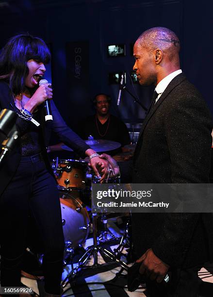 Singer Jennifer Hudson and Jamie Foxx perform at the Samsung Galaxy Shangri-La Party in the Big Easy with the New Orleans Preservation Hall Jazz...