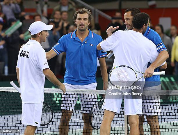 Julien Bennetteau and Michael Llodra of France celebrate their victory after their doubles match against Jonathan Erlich and Dudi Sela of Israel on...
