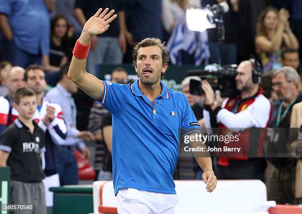 Julien Bennetteau of France celebrates his victory with teammate Michael Llodra after their doubles match against Jonathan Erlich and Dudi Sela of...