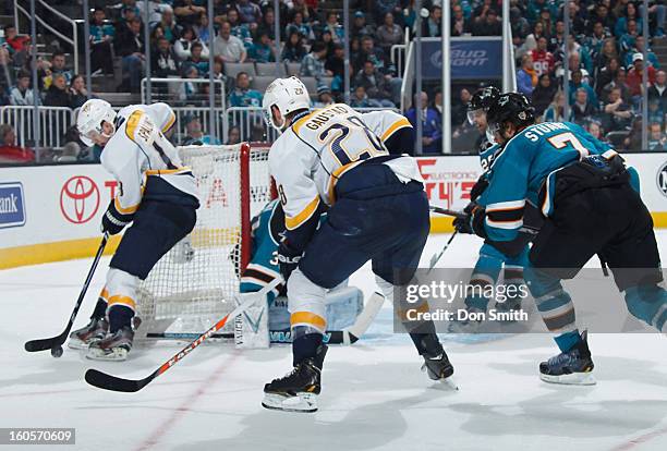 Brad Stuart, Michal Handzus and Antti Niemi of the San Jose Sharks protect the net against Nick Spaling and Paul Gaustad of the Nashville Predators...