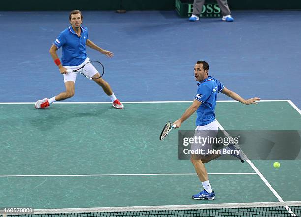 Julien Bennetteau and Michael Llodra of France in action during their doubles match against Jonathan Erlich and Dudi Sela of Israel on day two of the...