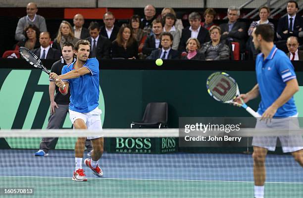 Julien Bennetteau and Michael Llodra of France in action during their doubles match against Jonathan Erlich and Dudi Sela of Israel on day two of the...