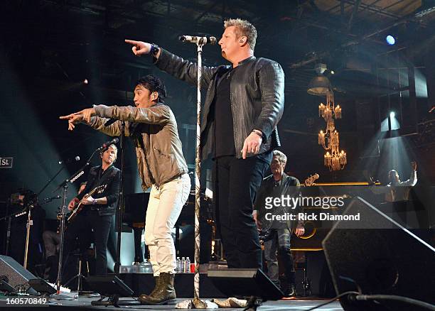 Arnel Pineda and Gary LeVox perform onstage as Journey and Rascal Flatts headline the Super Bowl XLVII CMT Crossroads Concert on February 2, 2013 in...