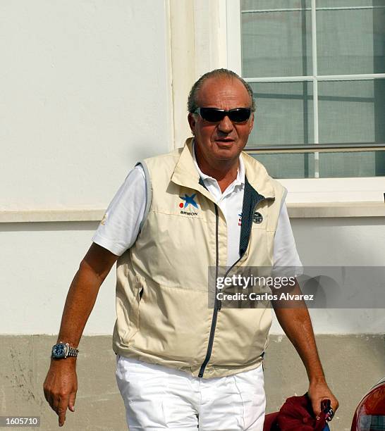 King Juan Carlos of Spain arrives at the Royal Club Nautical during the first day of the 20th "Copa del Rey" regatta July 31, 2001 at Palma de...
