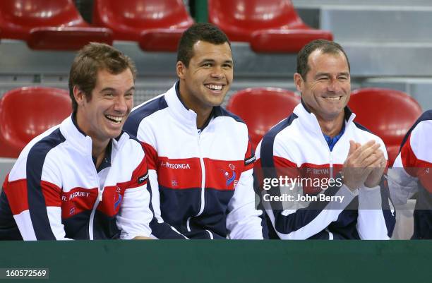 Richard Gasquet, Jo-Wilfried Tsonga, Paul Quetin, fitness coach of France share a laugh during the doubles match on day two of the Davis Cup first...