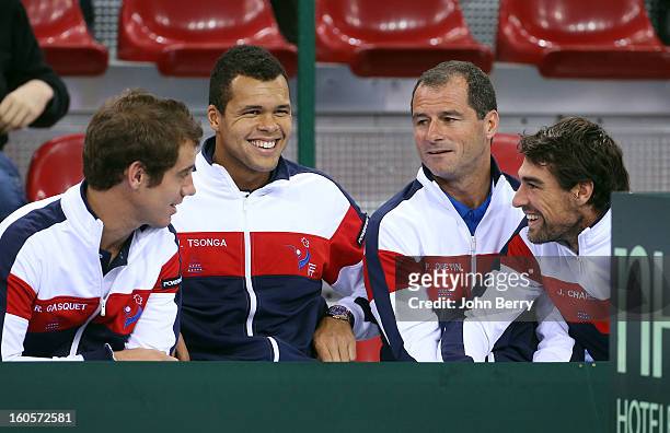 Richard Gasquet, Jo-Wilfried Tsonga, Paul Quetin, fitness coach and Jeremy Chardy of France share a laugh during the doubles match on day two of the...