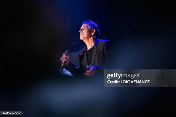 French singer Julien Clerc performs in La Baule, western France, on August 17 during the Dryadestivales music Festival. Julien Clerc's half brother,...