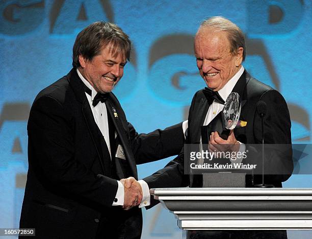 Stage manager Dency Nelson accepts the Franklin Schaffner Award from producer George Stevens Jr. Onstage during the 65th Annual Directors Guild Of...