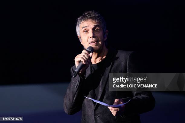 French singer Julien Clerc addresses the audience as he pays tribute to his half-brother Gerard Leclerc in La Baule, western France, on August 17...