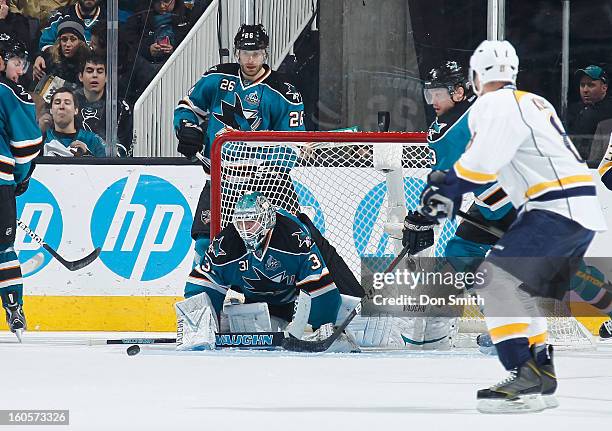 Antti Niemi, Michal Handzus and Douglas Murray of the San Jose Sharks defend the net against the Nashville Predators during an NHL game on February...