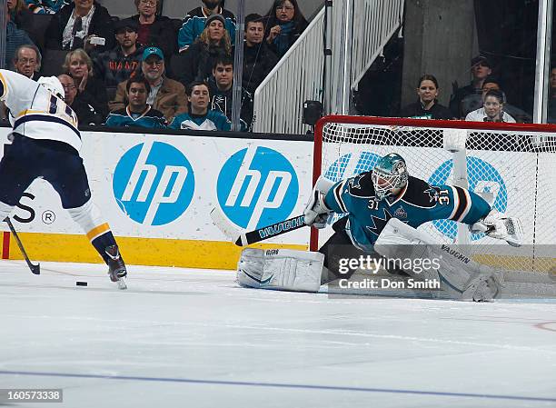 Antti Niemi of the San Jose Sharks stretches out to try to make a save against David Legwand of the Nashville Predators during an NHL game on...