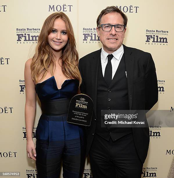 Actress Jennifer Lawrence and director David O. Russell visit The Moet & Chandon Lounge after she received the Outstanding Performer of the Year...