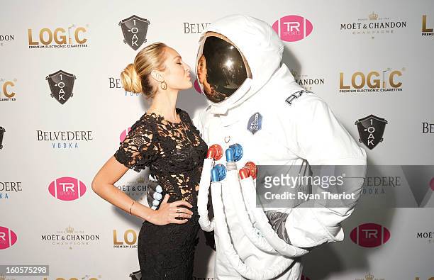 Model Candice Swanepoel poses with an AXE astronaut at 1 OAK New Orleans Presented By LOGIC Electronic Cigarettes at Jax Brewery on February 2, 2013...