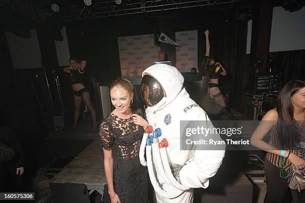 Model Candice Swanepoel poses with an AXE astronaut at 1 OAK New Orleans Presented By LOGIC Electronic Cigarettes at Jax Brewery on February 2, 2013...