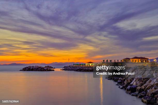 sunset in marina di pisa, tuscany, italy - marina di pisa fotografías e imágenes de stock