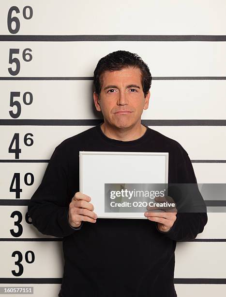 mugshot of a man - mugshot stockfoto's en -beelden