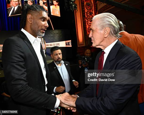 Tim Duncan & Pat Riley embrace during the 2023 Basketball Hall of Fame Enshrinement Ceremony on August 12, 2023 at Springfield Marriott in...