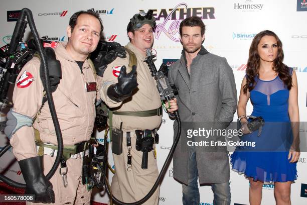 Daniel Gillies and Rachael Leigh Cook pose with Ghostbusters at the Tenth Annual Leather & Laces Super Bowl Party on February 2, 2013 in New Orleans,...