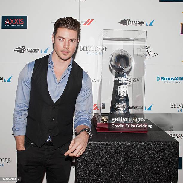 Josh Henderson poses with the Lombardi trophy at the Tenth Annual Leather & Laces Super Bowl Party on February 2, 2013 in New Orleans, Louisiana.