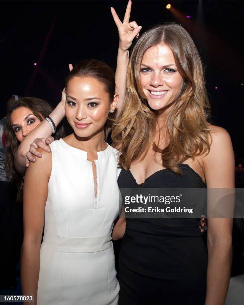 Rachael Leigh Cook photo bombs Jamie Chung and Brooklyn Decker at the Tenth Annual Leather & Laces Super Bowl Party on February 2, 2013 in New...