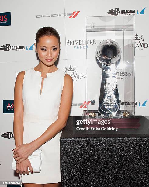 Jamie Chung poses with the Lombardi trophy at the Tenth Annual Leather & Laces Super Bowl Party on February 2, 2013 in New Orleans, Louisiana.
