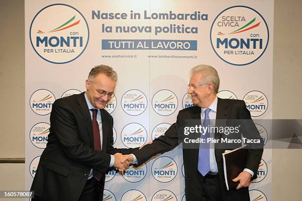 Mario Mauro and Italian Prime Minister Mario Monti attend the presentation of Lombardy candidates of 'Scelta Civica con Monti per l'Italia' on...