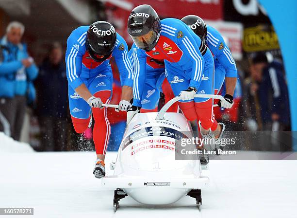 Alexander Zubkov, Alexey Negodaylo, Dmitry Trunenkov and Maxim Mokrousov of Russia compete during the Four Men Bobsleigh heat three of the IBSF Bob &...